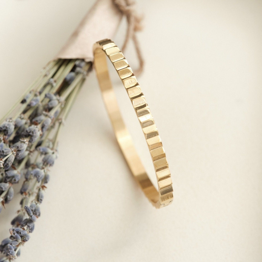 a close up of a bracelet on a table