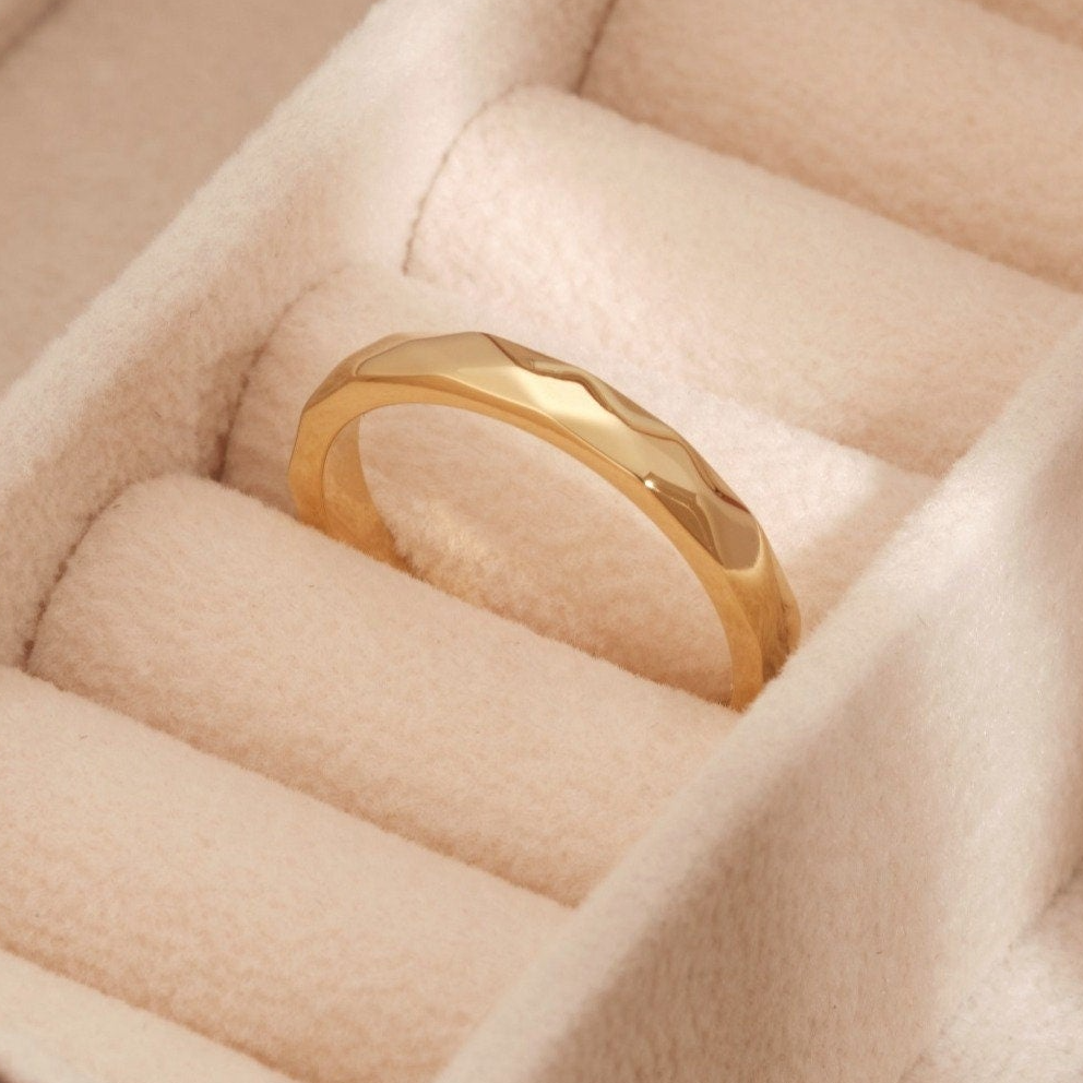 a close up of a ring in a box