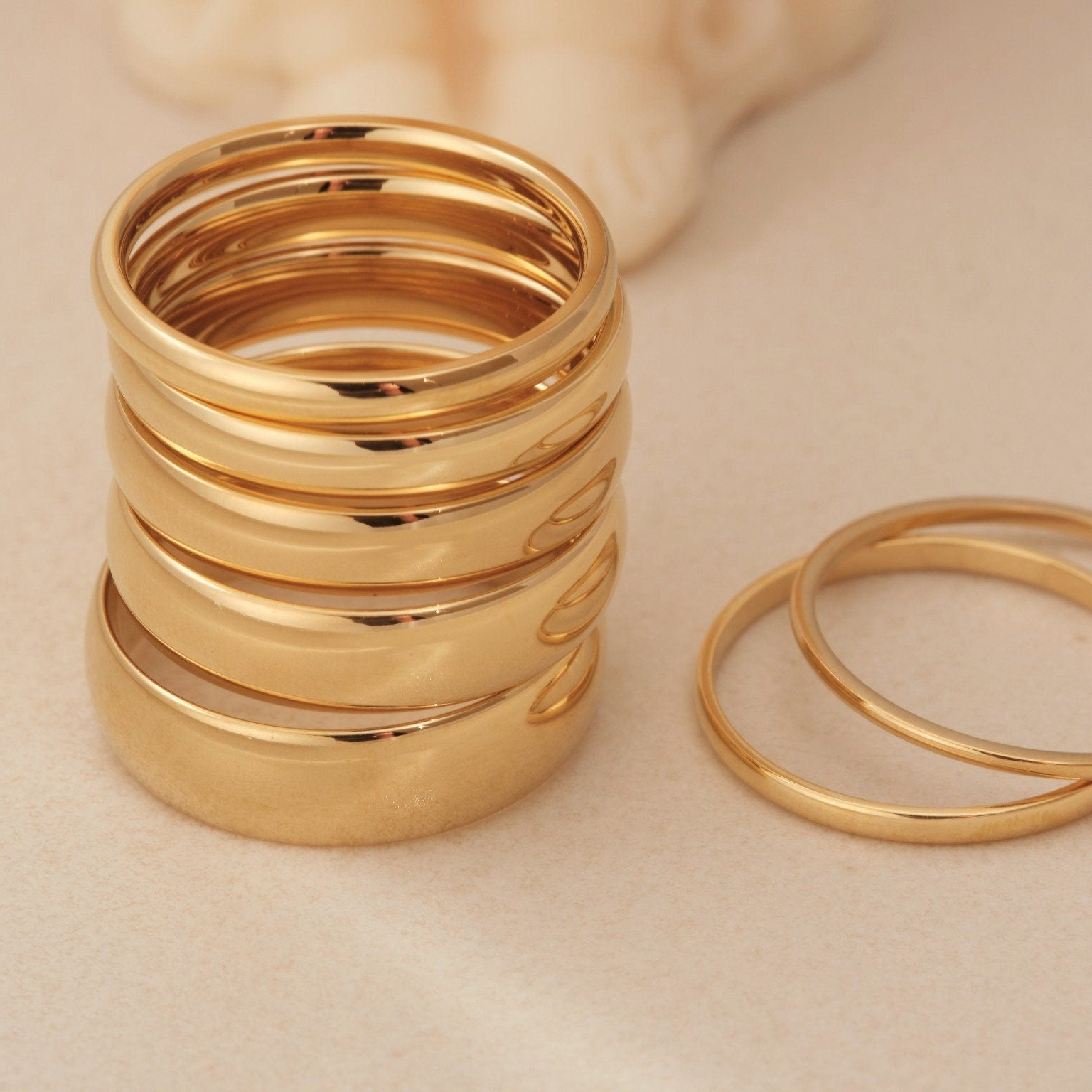 a stack of gold rings sitting on top of a table