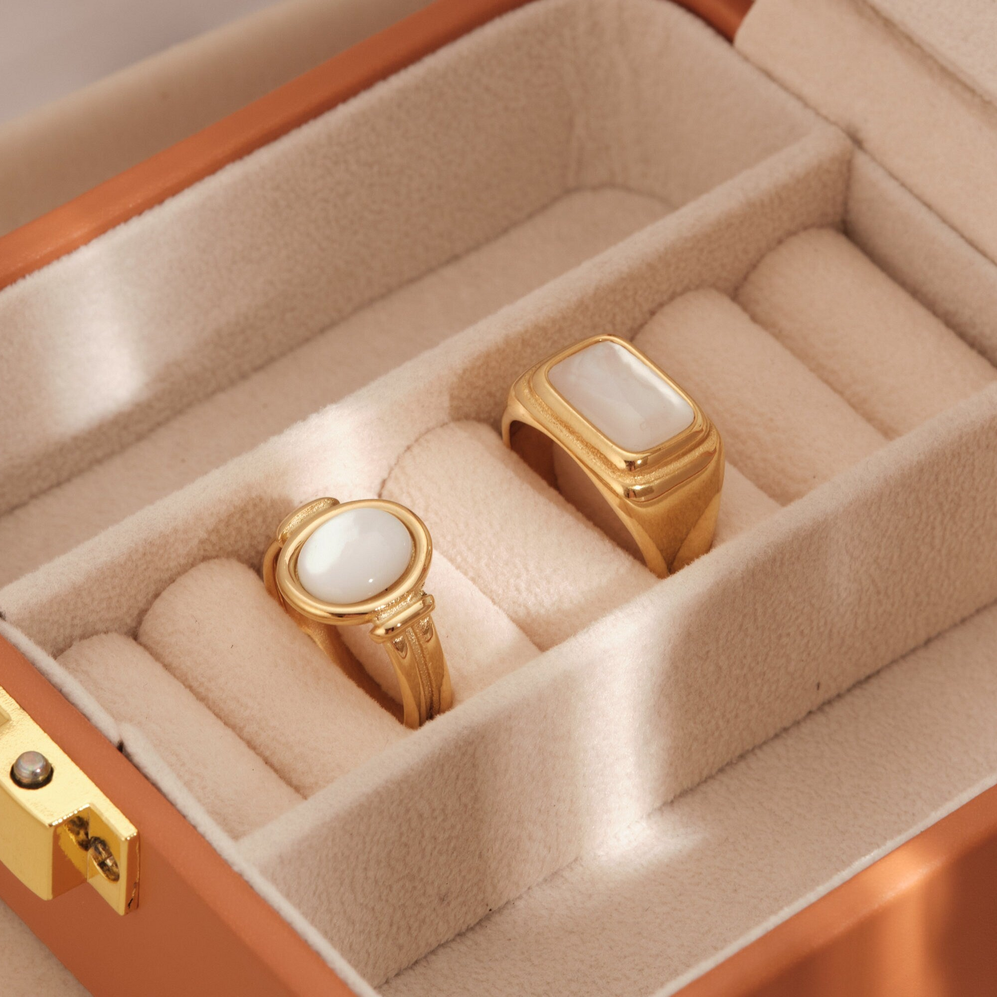 a couple of rings sitting inside of a box