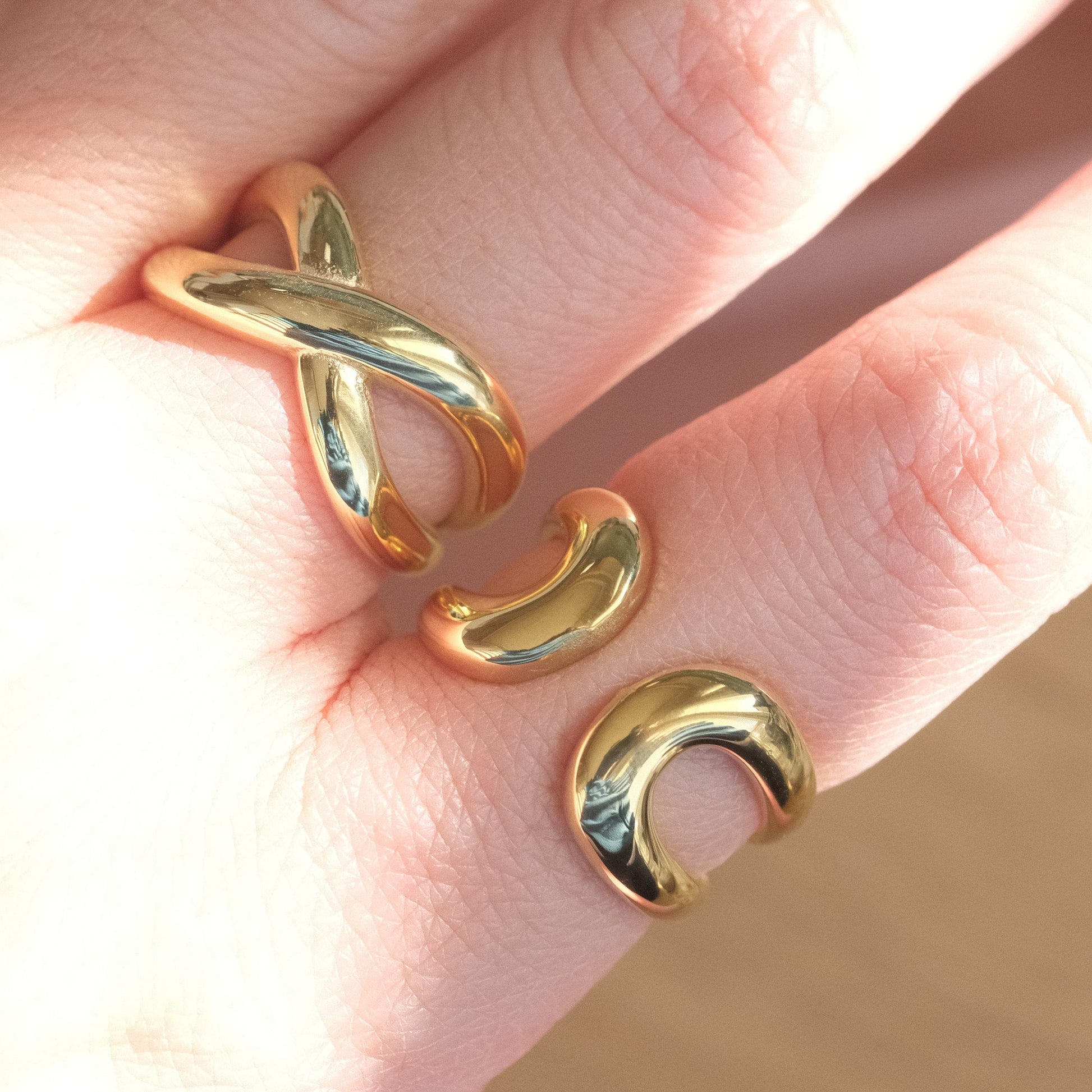 a woman's hand with two rings on it