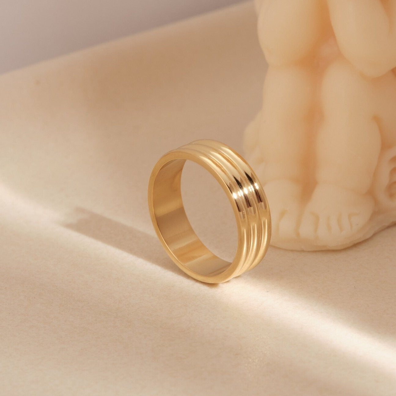 a gold ring sitting on top of a table