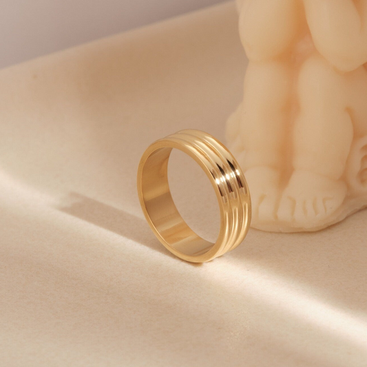 a gold ring sitting on top of a table