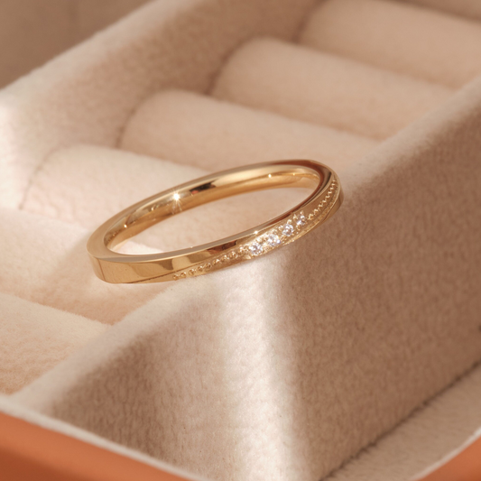 a close up of a ring in a box