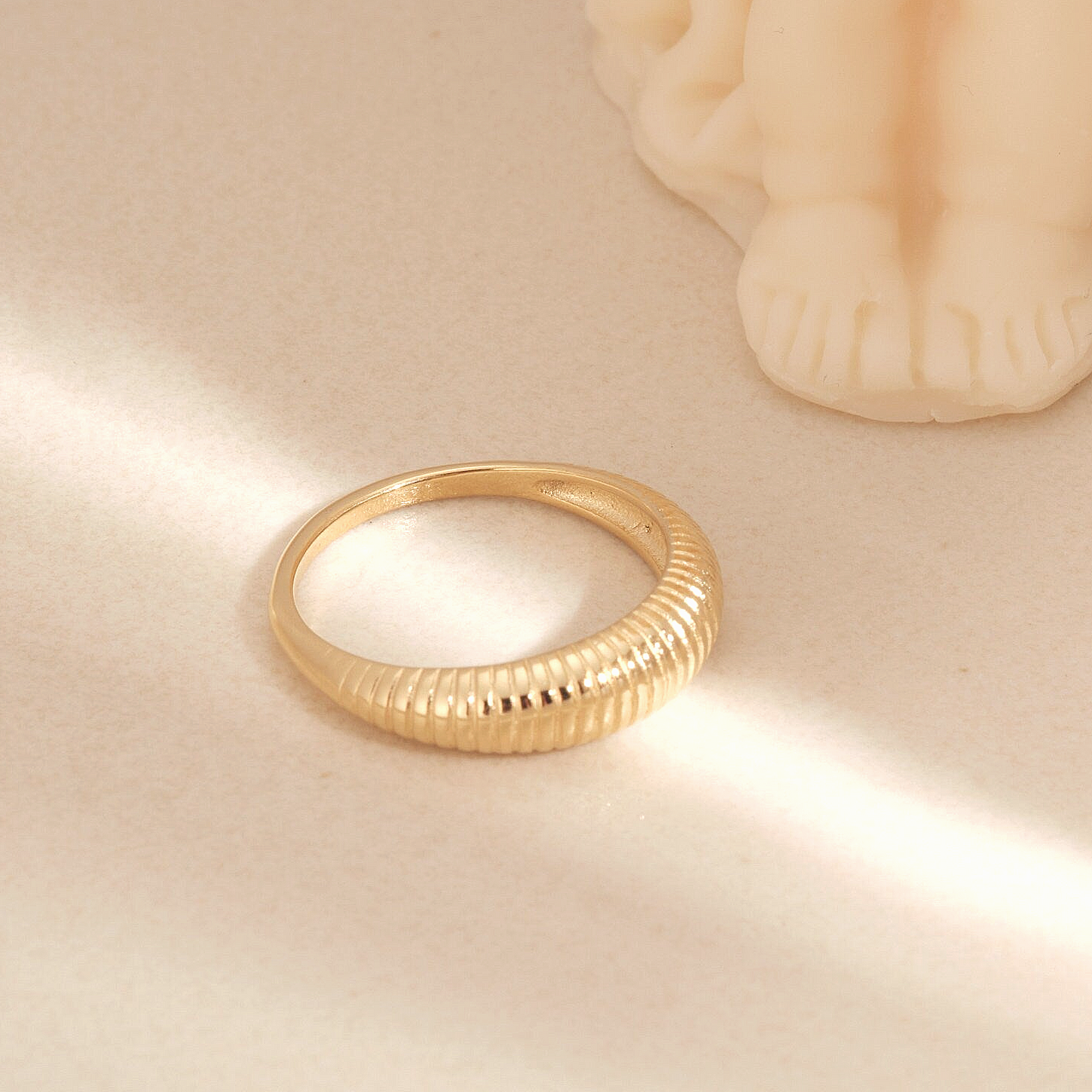 a gold ring sitting on top of a table